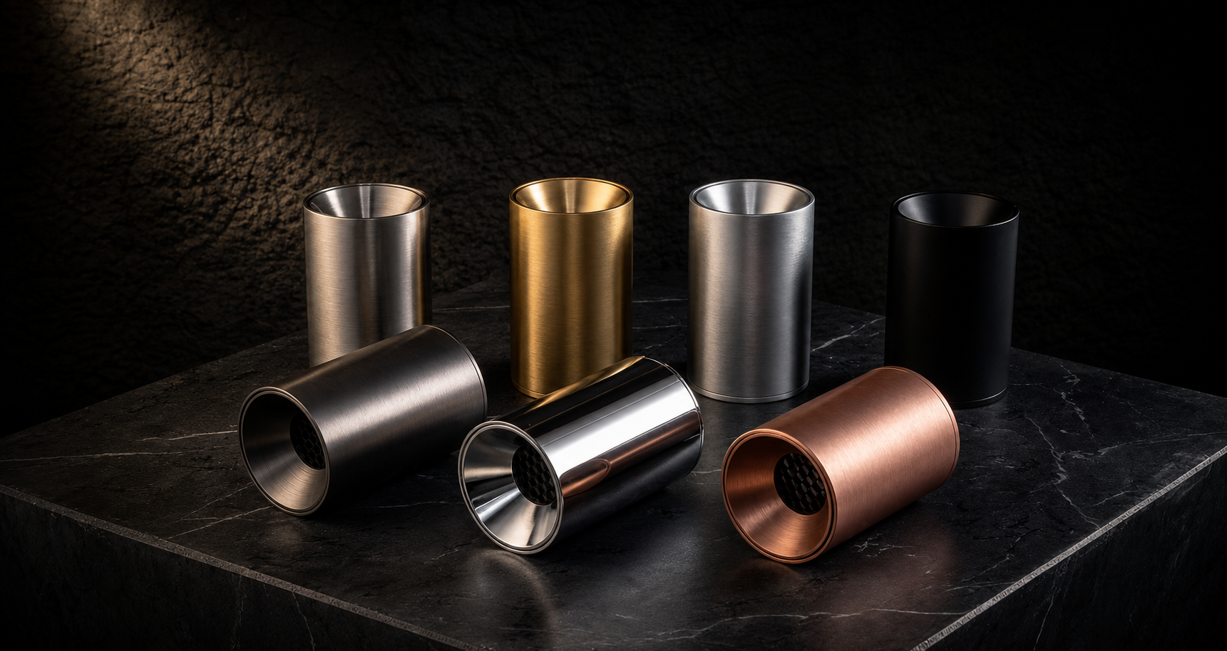 Premium cylindrical lighting fixtures in brushed metal finishes on dark marble